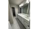 Double vanity bathroom with a large mirror and shower at 229 Lake George Dr, Shelby, NC 28152