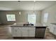 Kitchen island with granite countertop and white cabinets at 229 Lake George Dr, Shelby, NC 28152