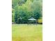 Landscaped backyard with gazebo and basketball hoop at 229 Lake George Dr, Shelby, NC 28152