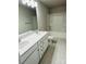 Bathroom with double vanity, tub, and tile flooring at 229 Lake George Dr, Shelby, NC 28152