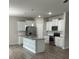 Modern kitchen with white cabinets, granite island, and stainless steel appliances at 229 Lake George Dr, Shelby, NC 28152