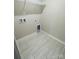 Laundry room with tile flooring and built-in shelving at 229 Lake George Dr, Shelby, NC 28152