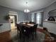 Formal dining room with hardwood floors and view of kitchen at 240 Bost St, Statesville, NC 28677