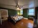 Spacious bedroom with wood floors and ceiling fan at 240 Bost St, Statesville, NC 28677