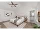 Main bedroom features a king-size bed, en-suite bathroom, and calming decor at 7118 Plott Rd, Charlotte, NC 28215