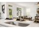 Modern kitchen sink and faucet with a view into the living room at 7118 Plott Rd, Charlotte, NC 28215