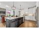 Modern kitchen with white cabinets and large island at 190 Hidden Meadows Dr, Mooresville, NC 28117