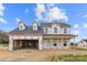 Two story house under construction with gray siding and a black garage door at 4202 Old Monroe Marshville Rd, Wingate, NC 28174