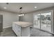 Kitchen island with granite countertops and access to deck at 314 S Government St, Lincolnton, NC 28092