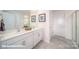 Elegant bathroom with double vanity, large mirror, and a walk-in shower at 131 Woodhall Way, Troutman, NC 28166