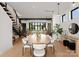 Modern dining room with an oval table, white chairs, and a view of the kitchen at 237 Marsh Rd # 101, Charlotte, NC 28209