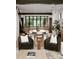 Open concept dining room with large windows and modern lighting at 237 Marsh Rd # 101, Charlotte, NC 28209