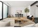 Modern living room with large windows, comfortable seating, and stylish decor at 237 Marsh Rd # 101, Charlotte, NC 28209