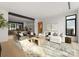 Spacious living area with large windows, comfortable seating, and modern decor at 237 Marsh Rd # 101, Charlotte, NC 28209