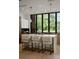 Modern kitchen island with white marble countertop and barstools at 237 Marsh Rd # 101, Charlotte, NC 28209