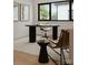 Modern home office with round table and comfortable chair at 237 Marsh Rd # 101, Charlotte, NC 28209