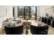Living room with large windows, modern furniture, and a neutral color scheme at 237 Marsh Rd # 101, Charlotte, NC 28209