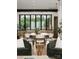 Modern dining area with large windows and a spacious wooden table at 237 Marsh Rd # 101, Charlotte, NC 28209