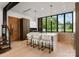 Modern kitchen with a large island, wood cabinets, and stainless steel appliances at 237 Marsh Rd # 101, Charlotte, NC 28209
