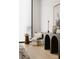 Minimalist sitting area with a black console table and comfy chair at 237 Marsh Rd # 101, Charlotte, NC 28209