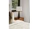 Serene bedroom with a nightstand and soft bedding at 237 Marsh Rd # 101, Charlotte, NC 28209