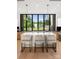 Modern kitchen features island with seating, sleek cabinetry, and expansive windows at 237 Marsh Rd # 101, Charlotte, NC 28209