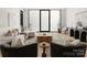 Spacious living room with large windows, comfortable seating and stylish decor at 237 Marsh Rd # 101, Charlotte, NC 28209