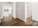 Bright hallway with wood floors leading to living areas at 2564 Blue Sky Meadows Dr, Monroe, NC 28110