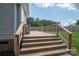 Wooden deck with stairs leading to the backyard at 7610 Sarah Dr, Denver, NC 28037