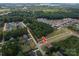 Aerial view of residential lot with neighboring houses and water at 7610 Sarah Dr, Denver, NC 28037