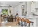 Open concept kitchen and dining area with island seating and modern finishes at 3112 Beacon Heights Rd, Indian Land, SC 29707