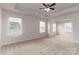 Well-lit bedroom with neutral walls and carpet flooring at 3141 Stephen Pace Trl, Huntersville, NC 28078