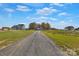 Gravel driveway leading to house with surrounding fields at 4206 Old Monroe Marshville Rd, Wingate, NC 28174