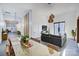 Open concept dining area and living room with glass dining table and gray couch at 1525 Shinnville Rd, Cleveland, NC 27013