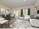 Bright living room with access to back patio at 1253 Falling Acorn Ln, Concord, NC 28027