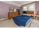 Bedroom with a double bed, dresser, and two windows at 3025 Rush Ave, Charlotte, NC 28208