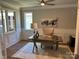 Bright home office featuring built-in shelving and hardwood floors at 1 Beth Haven Church Rd, Denver, NC 28037
