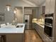 Modern kitchen with stainless steel appliances and large island at 1 Beth Haven Church Rd, Denver, NC 28037