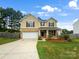 Two story house with attached garage and landscaping at 172 Morning Sun Dr, Mooresville, NC 28115