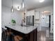 Modern kitchen with white cabinets, granite island, and stainless steel appliances at 162 Old Harbor Dr, Mount Gilead, NC 27306