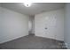 Well-lit bedroom with double doors leading to a hallway at 162 Old Harbor Dr, Mount Gilead, NC 27306