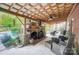 Relaxing outdoor space with stone fireplace, covered patio, and ceiling fan at 14001 Cabarrus Station Rd, Midland, NC 28107