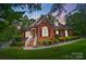 Brick home with landscaping and a large window at 14001 Cabarrus Station Rd, Midland, NC 28107