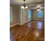 Bright living room with hardwood floors, a ceiling fan, and plenty of natural light at 2407 Vale Ave, Kannapolis, NC 28081