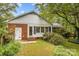 House back view with lush green yard at 4820 Montclair Ave, Charlotte, NC 28211