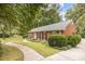 Brick ranch home with landscaping at 4820 Montclair Ave, Charlotte, NC 28211