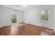 Bedroom with hardwood floors and two windows providing natural light at 4820 Montclair Ave, Charlotte, NC 28211