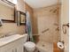 Updated bathroom with shower/tub combo and built-in shelving at 11214 Sudbury Rd, Davidson, NC 28036