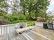 Wooden deck with white railings overlooking a fenced backyard at 11214 Sudbury Rd, Davidson, NC 28036