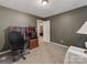 Home office with a desk, chair, and built-in shelving at 11214 Sudbury Rd, Davidson, NC 28036